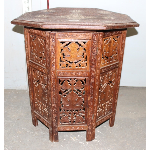 104 - A vintage Indian carved folding hardwood tea table