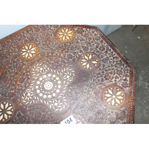 104 - A vintage Indian carved folding hardwood tea table