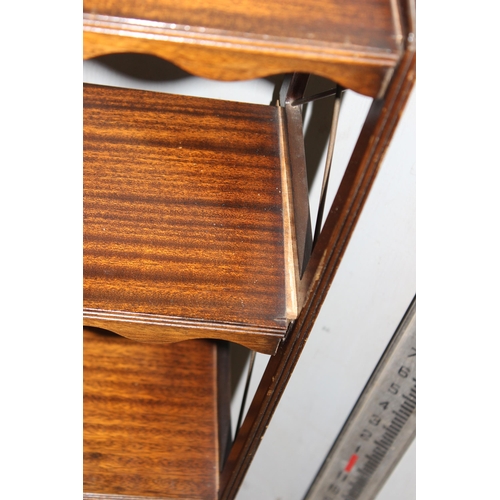 114 - Mahogany wall/ floor-standing shelves with drawer to base and brass detail to sides