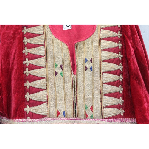 213 - An antique red velvet dress with heavy gold thread embroidery, possibly Turkish