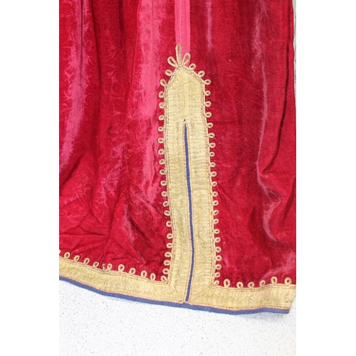 213 - An antique red velvet dress with heavy gold thread embroidery, possibly Turkish