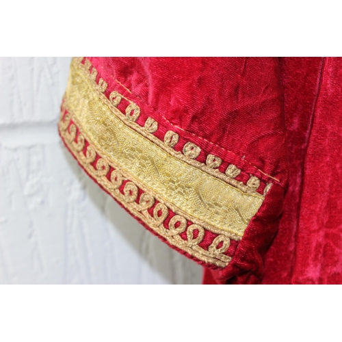 213 - An antique red velvet dress with heavy gold thread embroidery, possibly Turkish