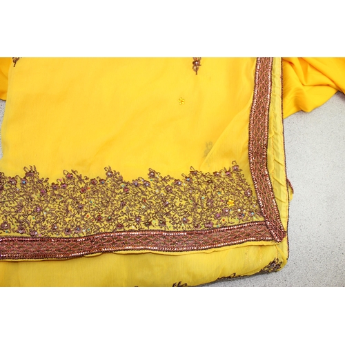 214 - Purple sari with gold thread embroidery, yellow female trousers, vest and along wrap with bead embro... 