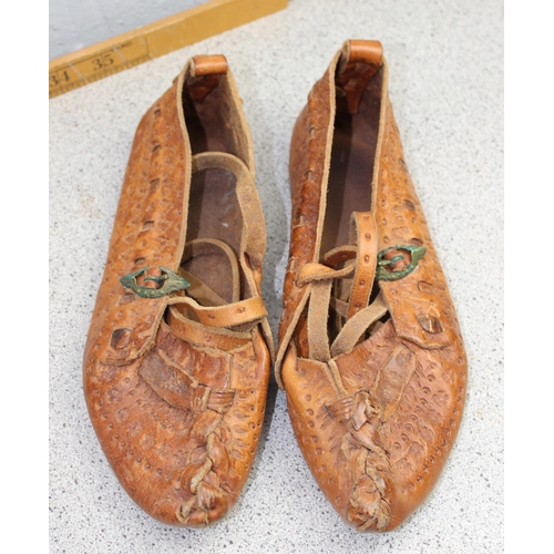 215 - 4 pairs of traditional leather Kierpce shoes and a Goral/ Zakopane traditional axe