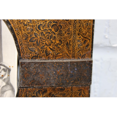 456 - An antique Liberty style Kashmiri frame with religious print