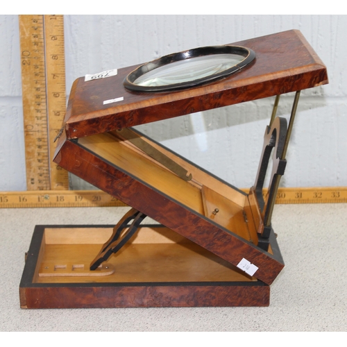 709 - A late Victorian walnut magnifier or viewer with 5 inch magnifier and folding adjustable stand