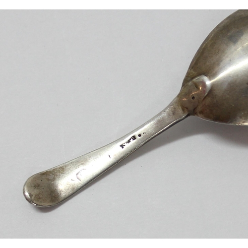 1118 - An early 19th century silver caddy spoon with bright cut decoration, marks rubbed, and a pair of sug... 