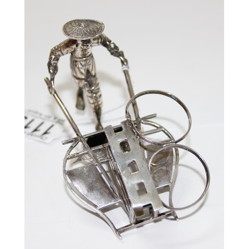 1119 - A Chinese export silver cruet set formed as a male figure pushing a barrow, marks for TC possibly Tu... 