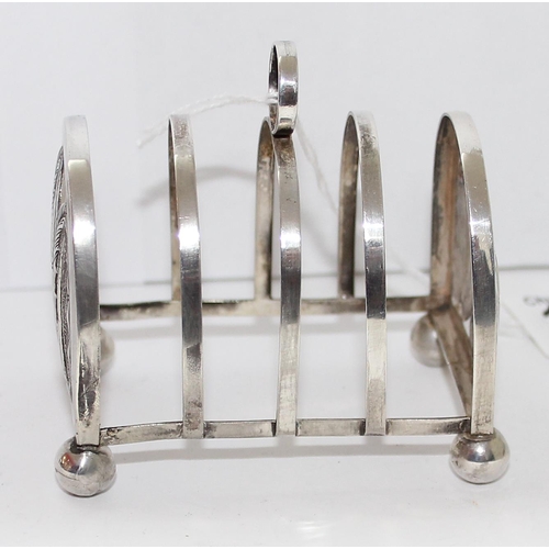 1131 - White metal four slice toast rack, possibly continental silver, approx 37g gross