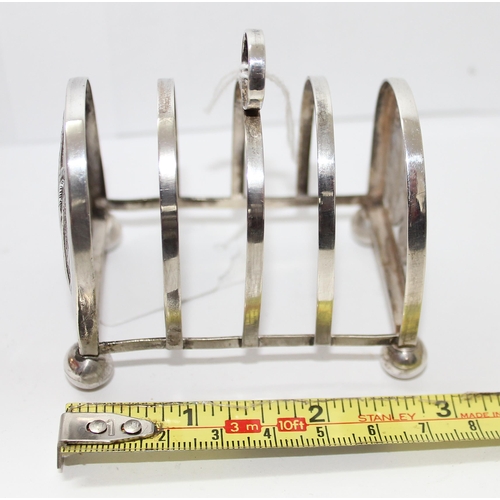 1131 - White metal four slice toast rack, possibly continental silver, approx 37g gross