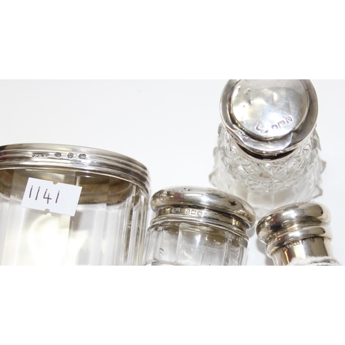 1141 - 4 silver mounted dressing table jars and bottles, various dates and makers