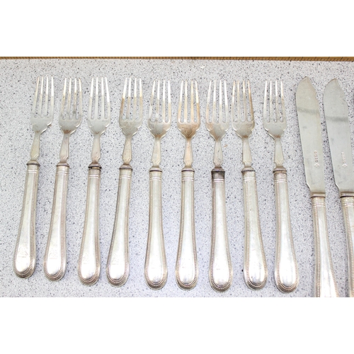 1153 - A qty of silver fish knives and forks, with silver filled handles and silver blades, Sheffield 1881 ... 