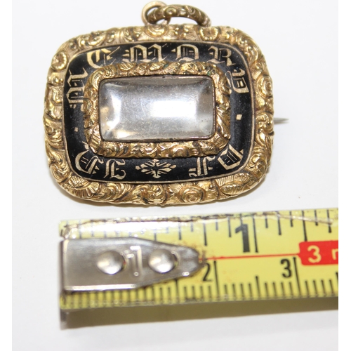 1233 - A Victorian yellow metal and black enamel mourning brooch, unmarked, approx 32mm wide, approx 14.25g... 