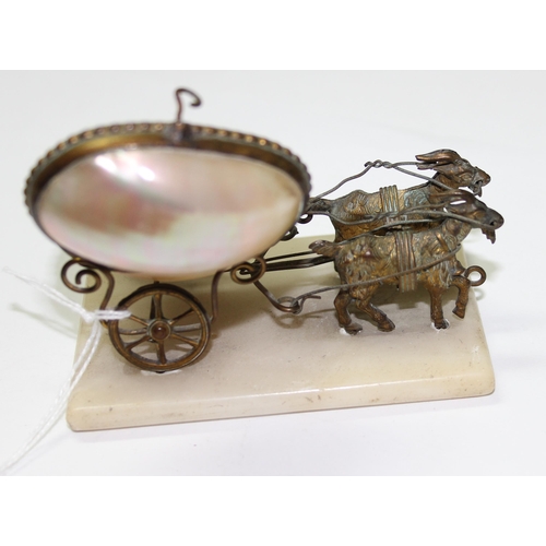 1627 - An unusual Palais Royale antique gilt metal and mother of pearl model of a pair of goats pulling a c... 