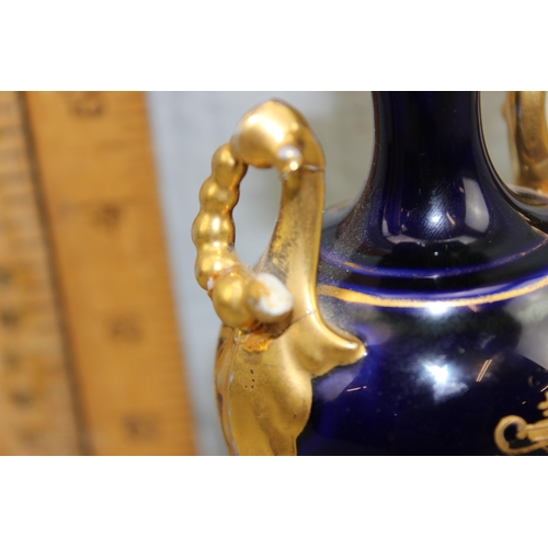 1652 - An antique Vienna porcelain vase of cobalt ground with gilt decoration and a hand painted vignette o... 