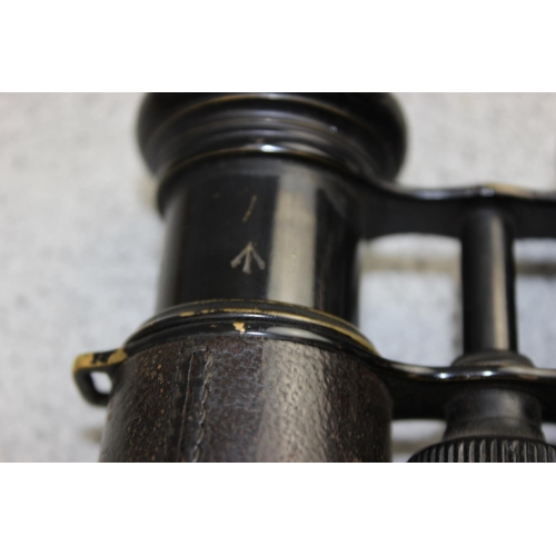 1061 - A pair of WW1 period black painted brass and leather officer's private purchase military binoculars ... 