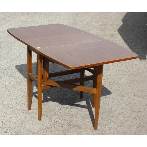 124 - A retro Formica topped drop leaf dining table