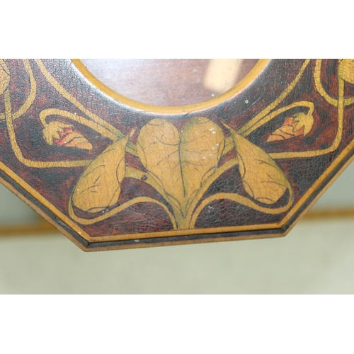 1666 - An early 20th century octagonal Art Nouveau pokerwork picture frame