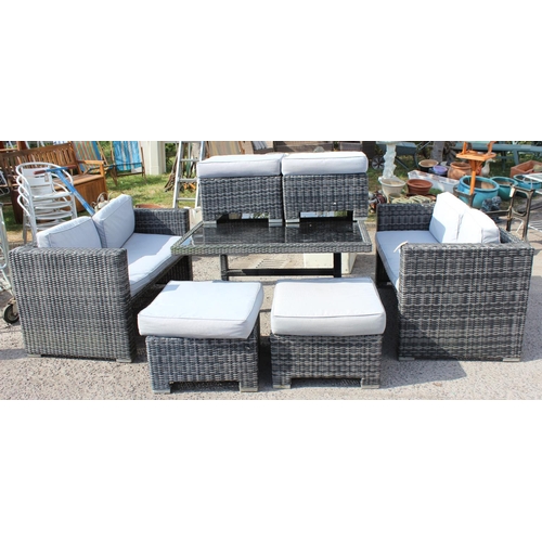 374 - Rattan set of garden furniture, a large glass topped table, 4 stools with cushions, and 2 sofas