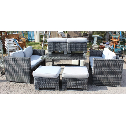 374 - Rattan set of garden furniture, a large glass topped table, 4 stools with cushions, and 2 sofas