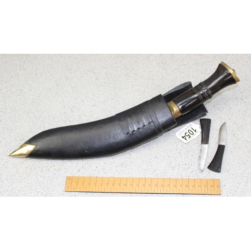 1054 - Kukri knife and 2 smaller knives in leather and brass sheath