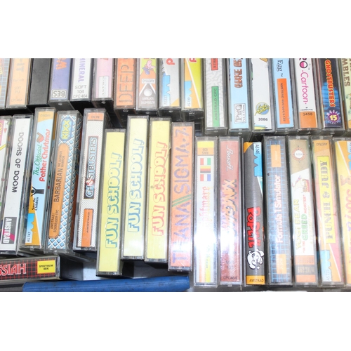 1547 - A large qty of vintage computer games cassettes, mainly Spectrum & Amstrad etc