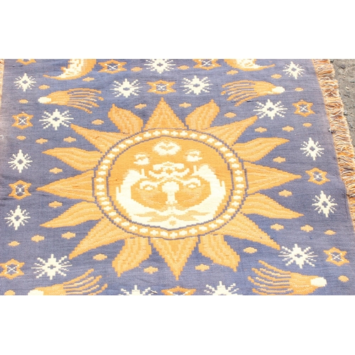 225 - Blue ground flat weave rug depicting celestial decorations