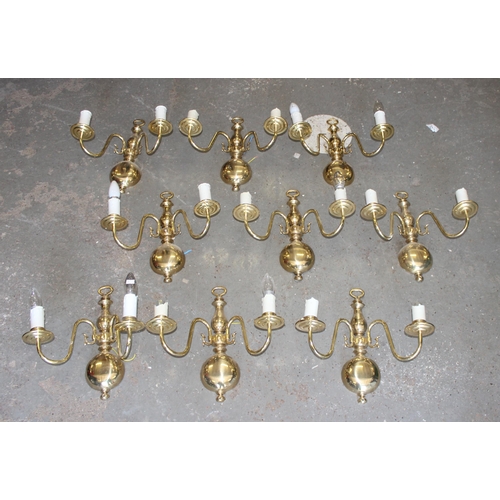 257 - 9 brass double wall lights and shades