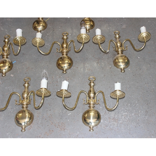 257 - 9 brass double wall lights and shades