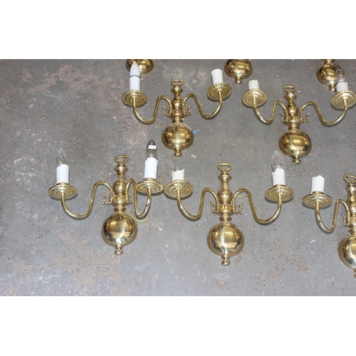 257 - 9 brass double wall lights and shades