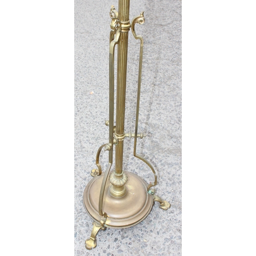 267 - An impressive vintage brass standard lamp on three feet