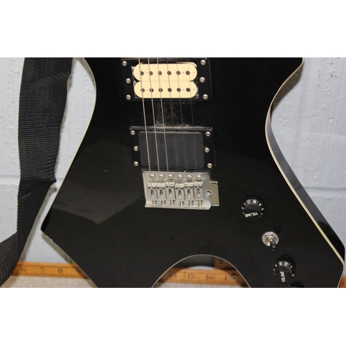 674 - Stagg electric guitar with angular black painted body, in Levy's guitar case