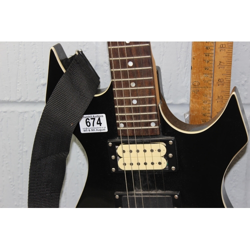 674 - Stagg electric guitar with angular black painted body, in Levy's guitar case