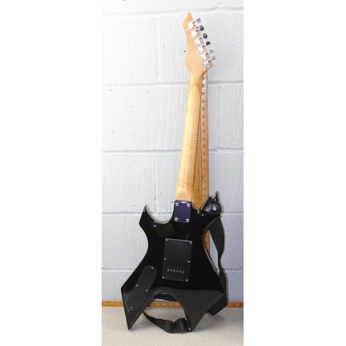 674 - Stagg electric guitar with angular black painted body, in Levy's guitar case