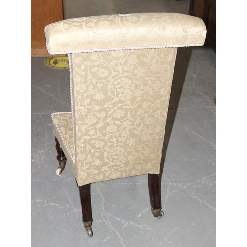 70A - An antique Prie Dieu chair with cream upholstery standing on turned wooden legs with brass and ceram... 