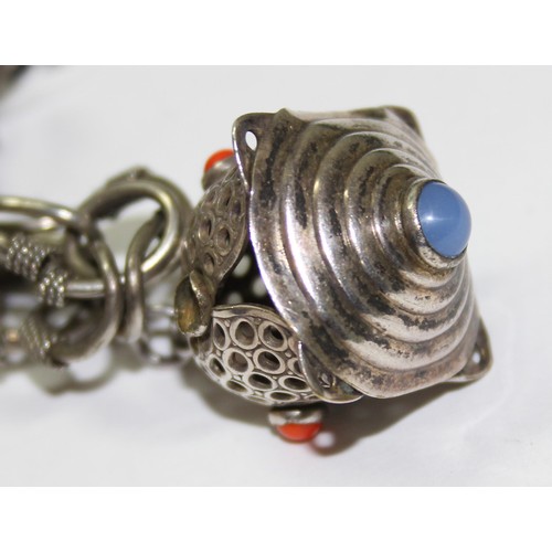 1236 - An Italian white metal charm bracelet, marked Italy, no silver marks