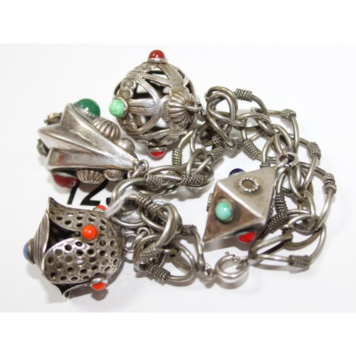 1236 - An Italian white metal charm bracelet, marked Italy, no silver marks