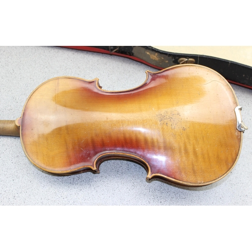 656A - A vintage violin and bow in case, the violin lacking label but with a single piece back