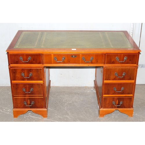 1 - A leather topped yew wood finished pedestal desk, approx 122cm wide