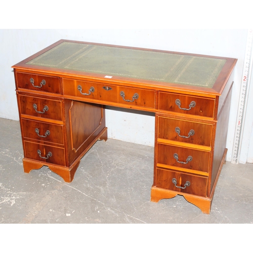 1 - A leather topped yew wood finished pedestal desk, approx 122cm wide