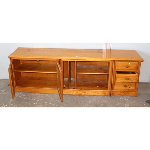 24 - A long low pine sideboard, approx 207cm wide