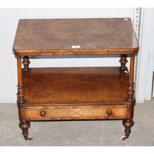 6 - A small antique walnut end table with drawer, on brass and ceramic castors