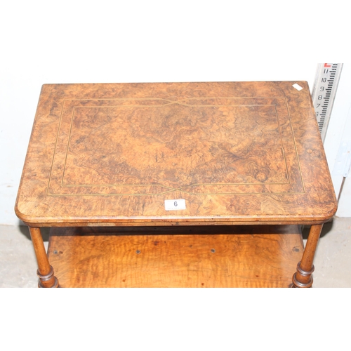 6 - A small antique walnut end table with drawer, on brass and ceramic castors