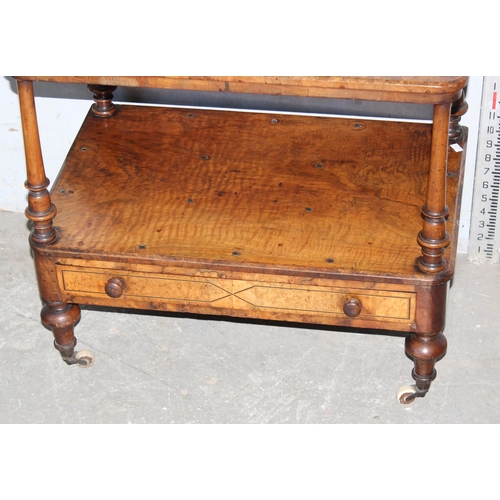 6 - A small antique walnut end table with drawer, on brass and ceramic castors