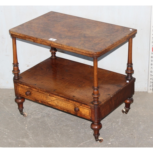 6 - A small antique walnut end table with drawer, on brass and ceramic castors