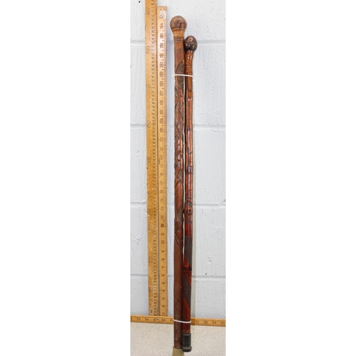 1607 - 2 vintage Oriental carved bamboo walking canes