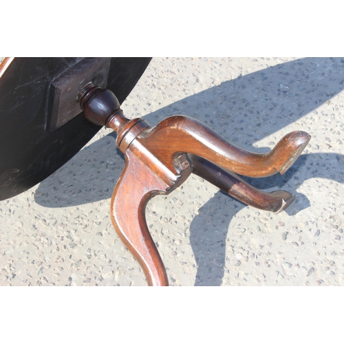 29 - A small antique mahogany tripod table