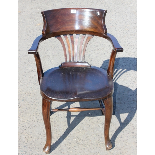 32 - An early 20th century stained wooden desk chair or armchair