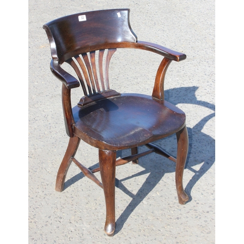 32 - An early 20th century stained wooden desk chair or armchair