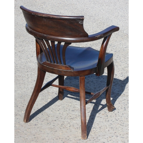 32 - An early 20th century stained wooden desk chair or armchair